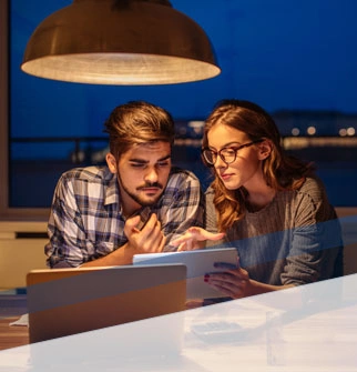 Young couple looking at mobile tablet